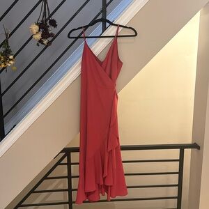 Pink/magenta flowy wrap dress. From Lulus. Perfect for a wedding guest.